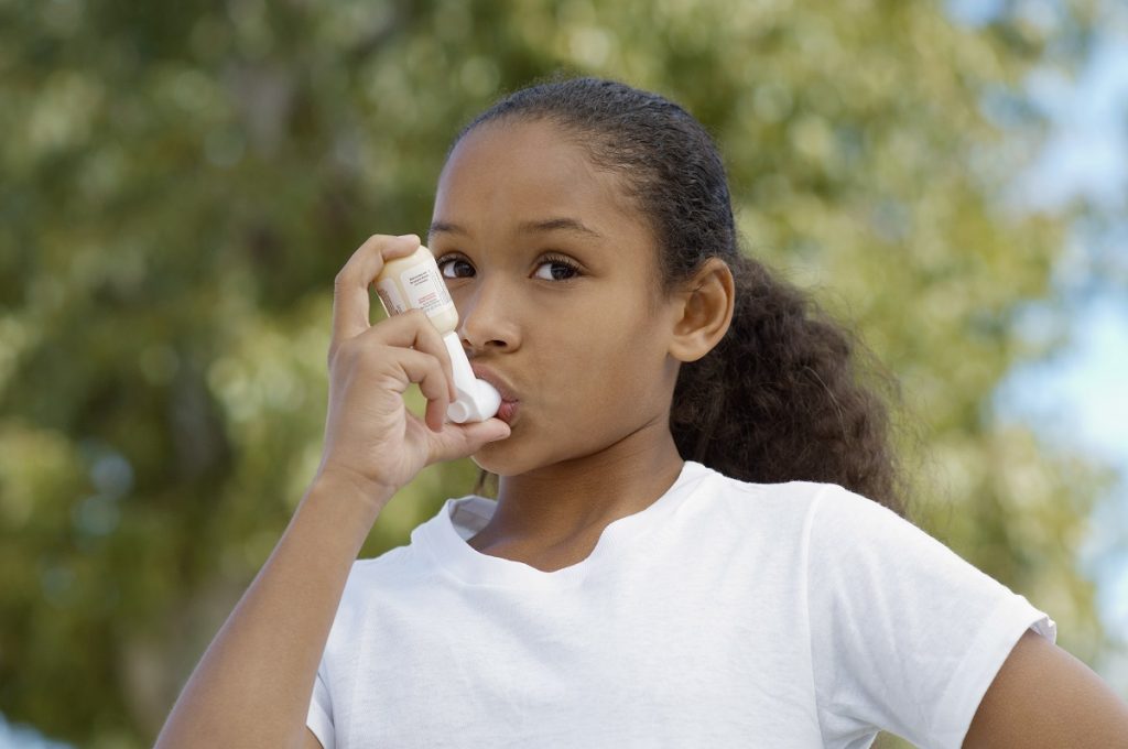 Child Holding an Inhaler