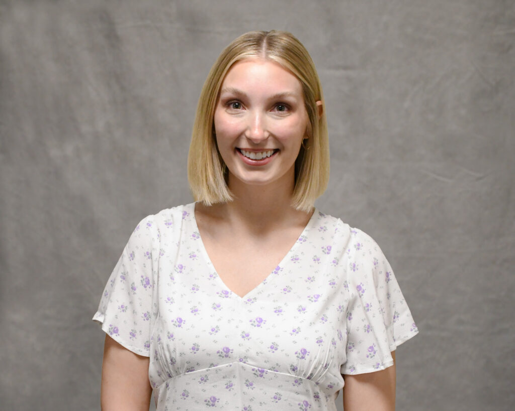 family health care provider Lydia Hill, in a white shirt and short blonde hair